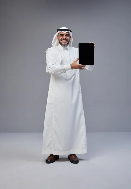 Saudi Man Holding Blank Tablet Screen in Studio