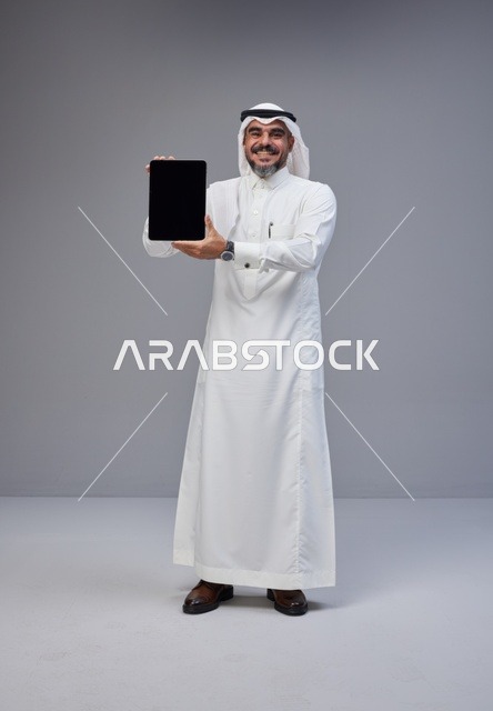 Saudi Man Holding Tablet Blank Screen Studio Shot