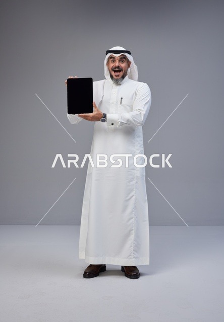 Saudi Man Holding Tablet with Blank Screen