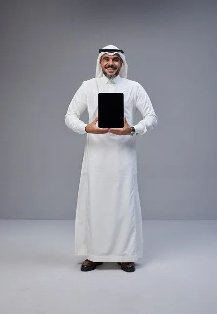 Saudi Man in Traditional Thobe Holding Blank Tablet