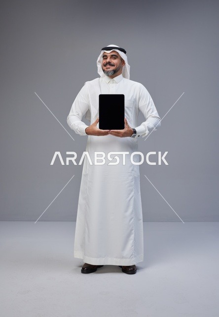 Saudi Man Holding Digital Tablet with Blank Screen
