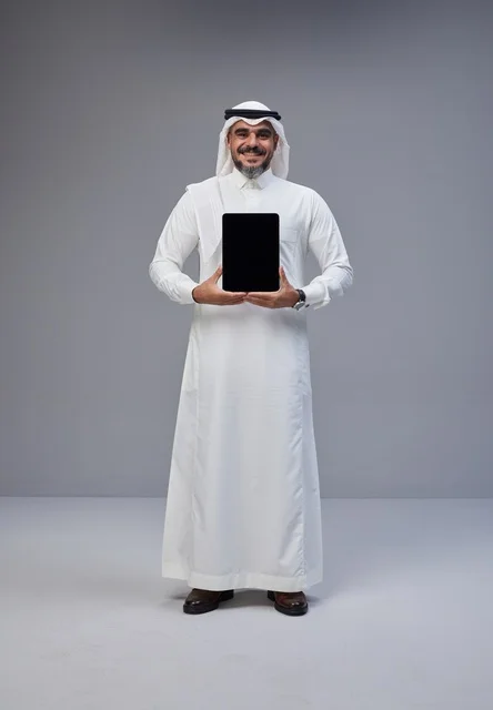 Saudi Man in Traditional Thobe Holding Blank Tablet