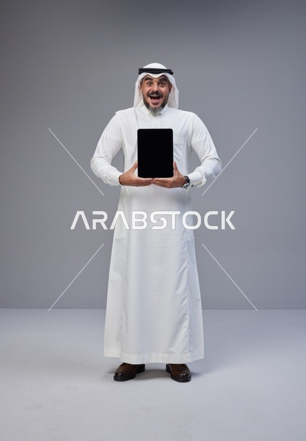Saudi Man Holding Tablet with Blank Screen