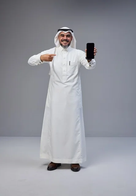 Saudi Man in Thobe Pointing to Blank Smartphone Screen