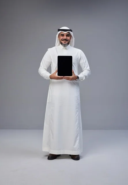 Saudi Man in Traditional Thobe Holding Tablet Mockup