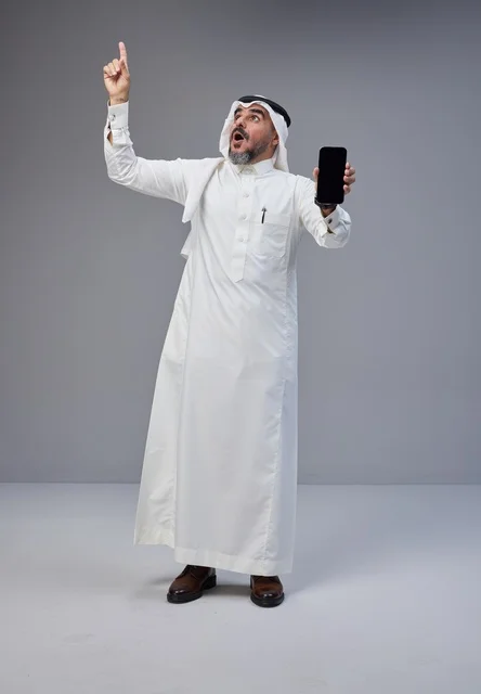 Saudi Man Holding Blank Smartphone Screen Pointing Up