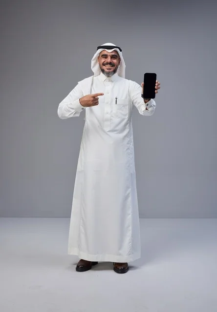Saudi Man Pointing at Blank Smartphone Screen