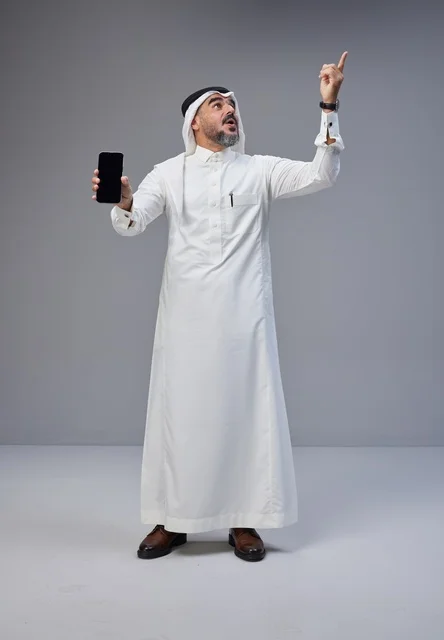 Saudi Man Holding Blank Smartphone Screen Pointing Up