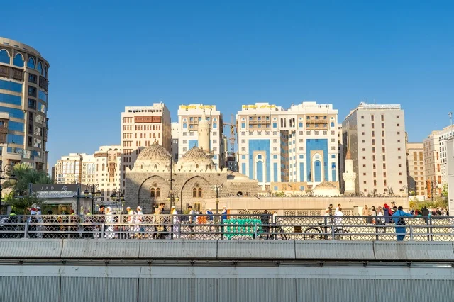Medina Cityscape with Historic Mosques and Modern Hotels