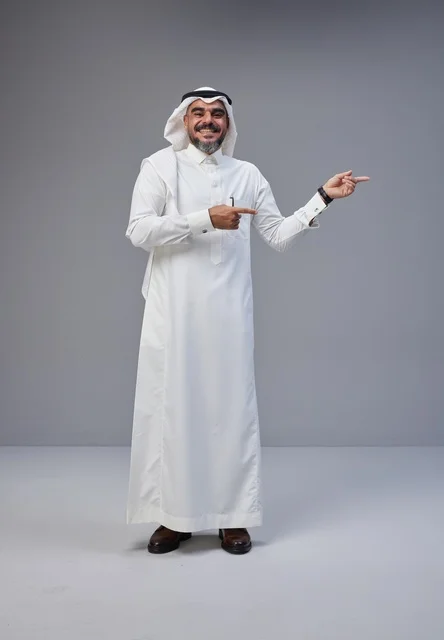 Saudi Man in Traditional Dress Pointing to the Side
