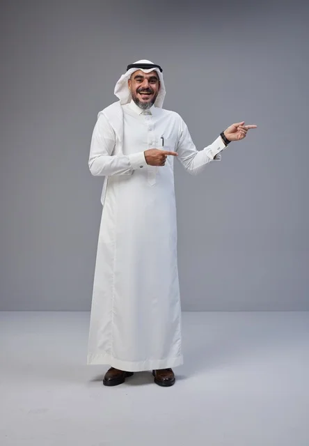 Saudi Man in Traditional Clothing Pointing in Studio