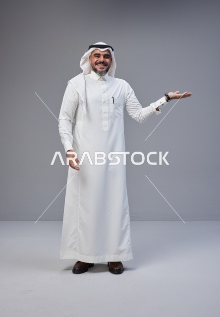 Saudi Man in Traditional Thobe Gesturing in Studio