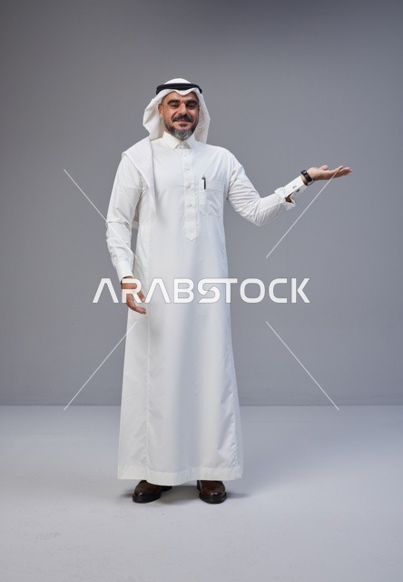 Saudi Man in Traditional Thobe Gesturing in Studio