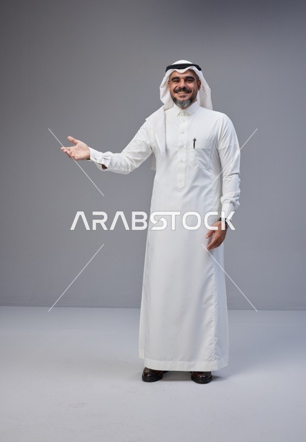 Saudi Man in Traditional Thobe Gesturing in Studio