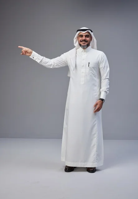 Saudi Man in Traditional Thobe Pointing in Studio