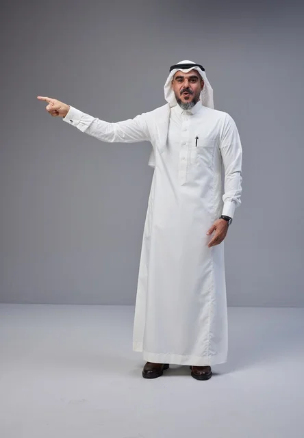 Saudi Man in Traditional Clothing Pointing in Studio