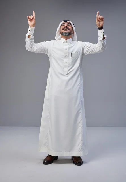 Saudi Man in Traditional Thobe Pointing Upwards