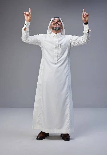 Saudi Man in Traditional Dress Pointing Upward