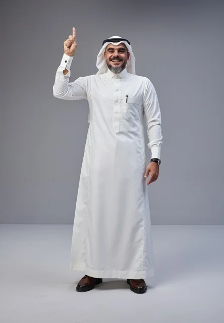 Saudi Man in Traditional Dress Pointing Upward