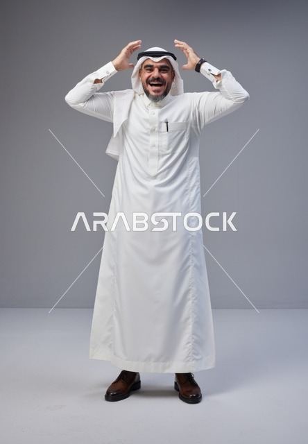 Smiling Saudi Man in Traditional Thobe Studio Portrait