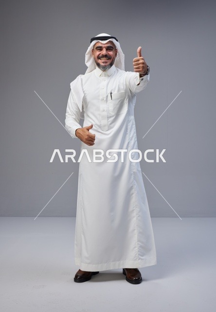 Saudi Man in Traditional Thobe Giving Thumbs Up