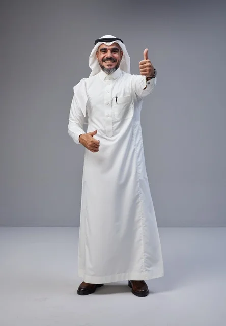 Saudi Man in Traditional Thobe Giving Thumbs Up