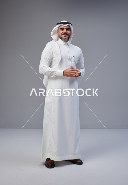 Saudi Man in Traditional Thobe Standing in Studio