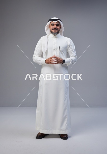Saudi Man in Traditional Thobe Standing in Studio