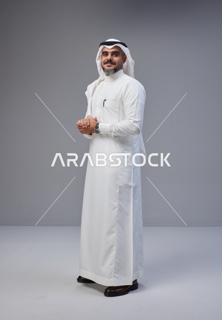 Saudi Man in Traditional Thobe Standing in Studio