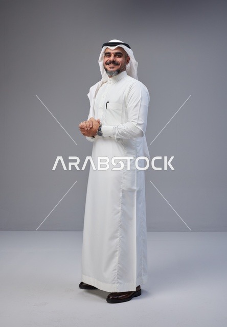 Saudi Man in Traditional Thobe on Grey Background