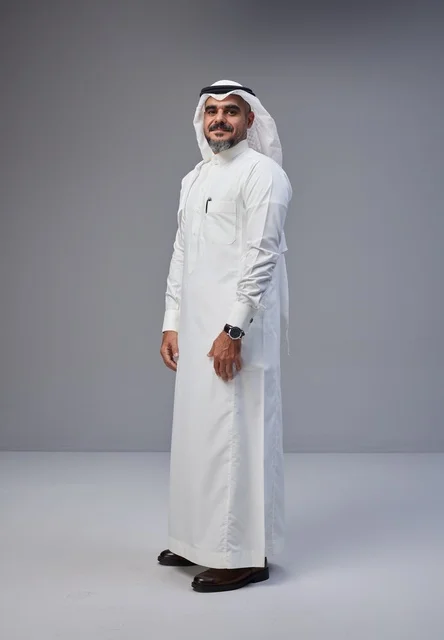 Saudi Man in Traditional White Thobe on Grey Background