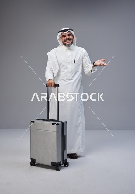 Saudi Man in Traditional Thobe with Travel Suitcase