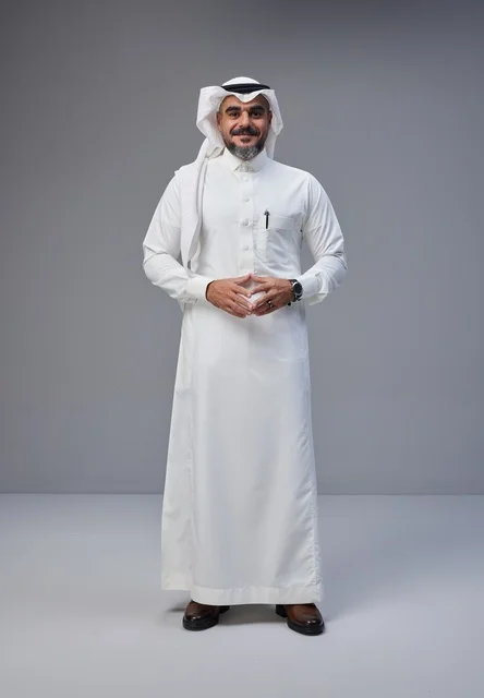 Saudi Man in Traditional Thobe on Gray Background
