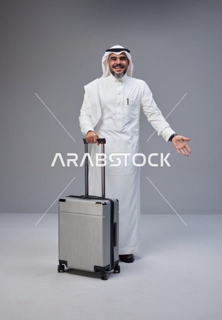 Saudi Man in Traditional Thobe with Travel Suitcase