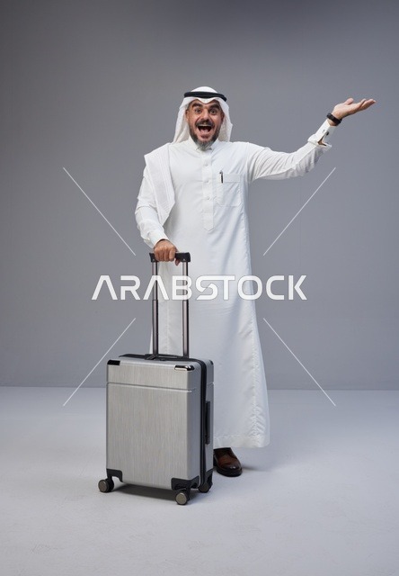 Saudi Man with Travel Suitcase on Grey Background