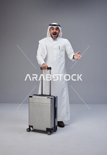 Saudi Man in Traditional Thobe with Suitcase