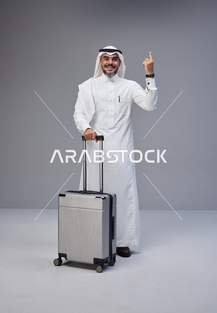 Saudi Man in Traditional Thobe with Suitcase