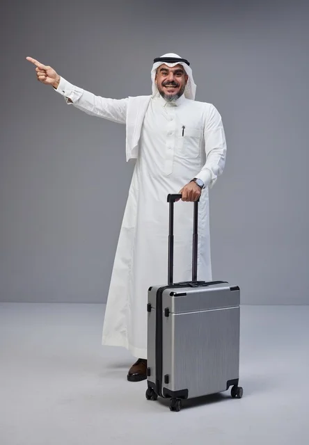 Saudi Man in Traditional Dress with Travel Suitcase