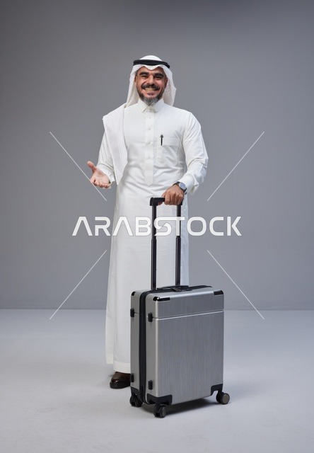 Saudi Man in Traditional Thobe with Suitcase