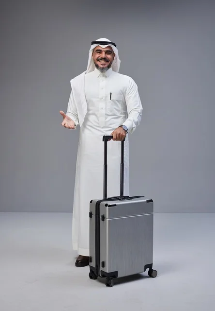 Saudi Man in Traditional Thobe with Suitcase