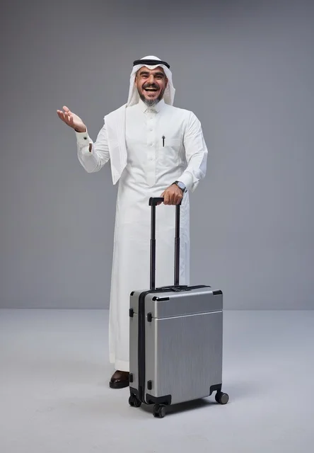 Saudi Man in Traditional Thobe with Travel Suitcase