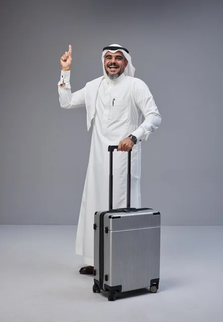 Saudi Man in Traditional Dress with Travel Suitcase