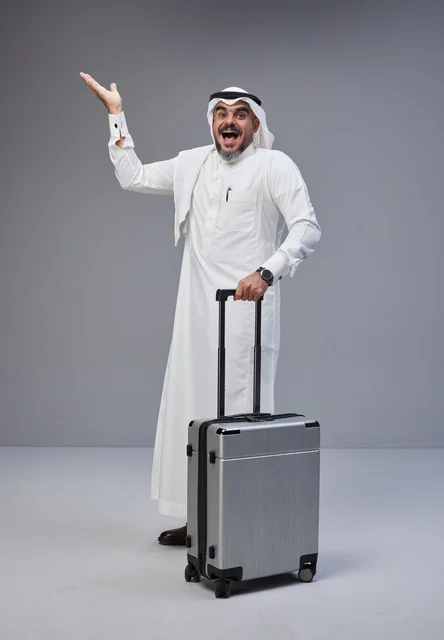 Saudi Man in Traditional Dress with Suitcase