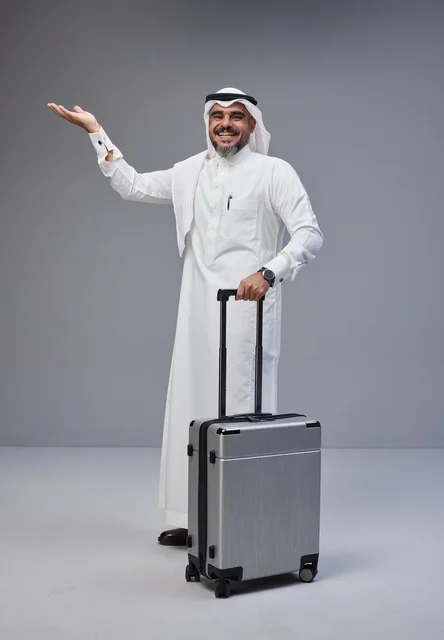 Saudi Man in Traditional Dress with Travel Suitcase
