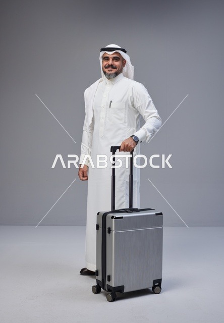 Saudi Man in Traditional Thobe with Travel Suitcase