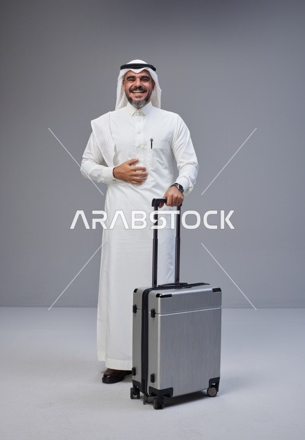 Saudi Man in Traditional Thobe with Travel Suitcase