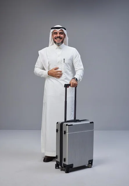 Saudi Man in Traditional Thobe with Travel Suitcase