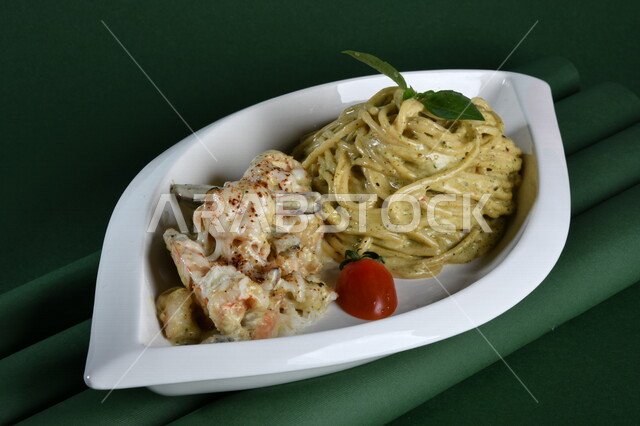 A plate of spaghetti with salad and tomatoes, a plate of spaghetti with cream, illustrated on a green background, chroma, Arabic fast food, fast food, delicious food
