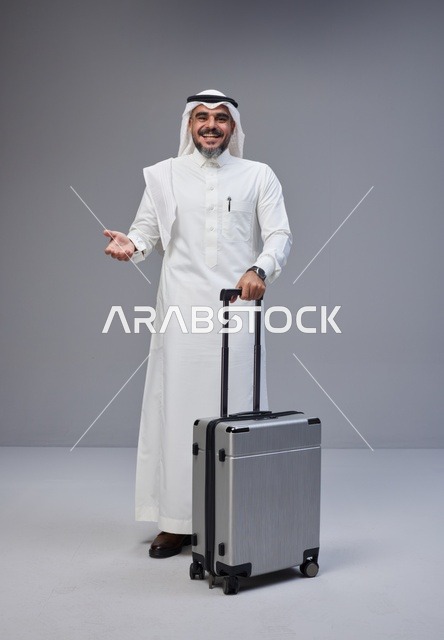 Saudi Man in Traditional Thobe with Travel Suitcase