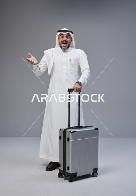 Saudi Man with Suitcase Expressing Surprise in Studio